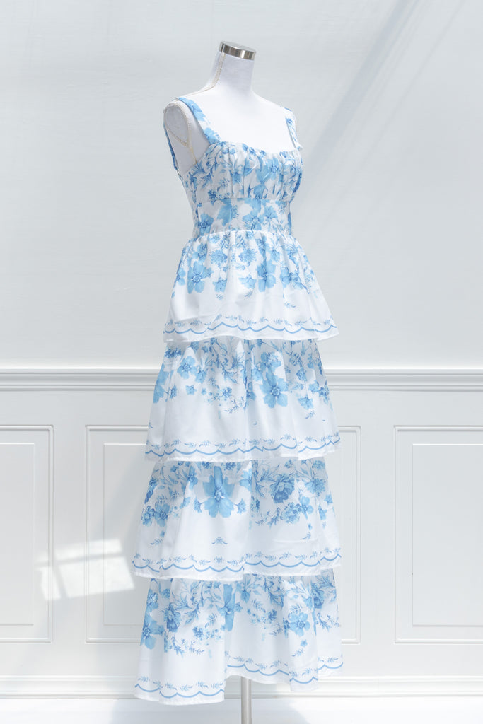 cotton maxi dresses - a blue floral and tiered dress. side view. amantine. 