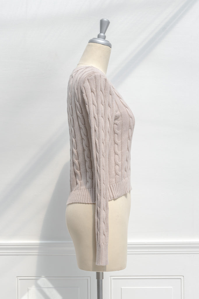 cute sweaters for fall - a classic taupe cable knit v neck pull over sweater. front view.