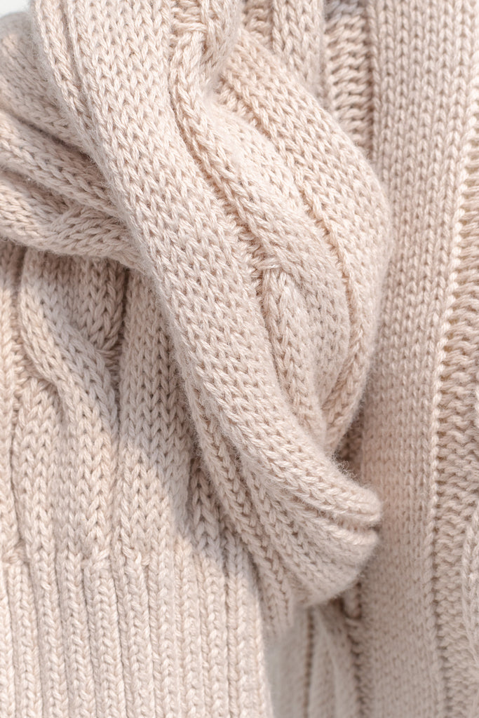 cute sweaters for fall - a classic taupe cable knit v neck pull over sweater. front view.