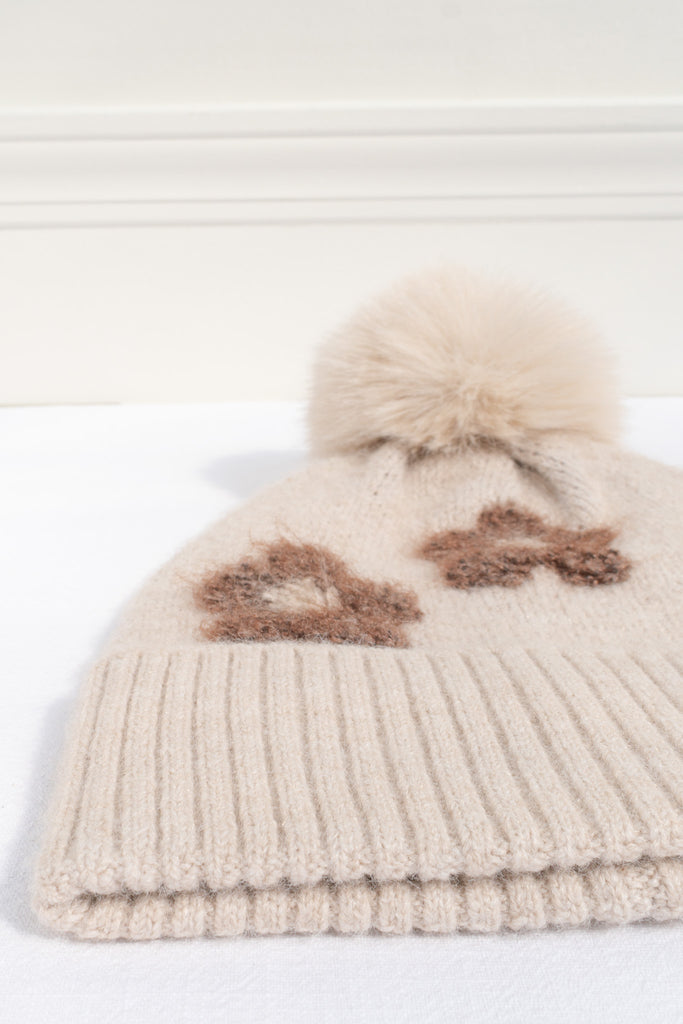 small gift for francophile - a french girl style beige beanie with floral detail and pompon. 