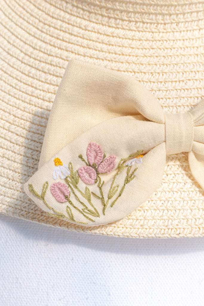 cottagecore and french girl style hair bow in beige and floral embroidered details. 