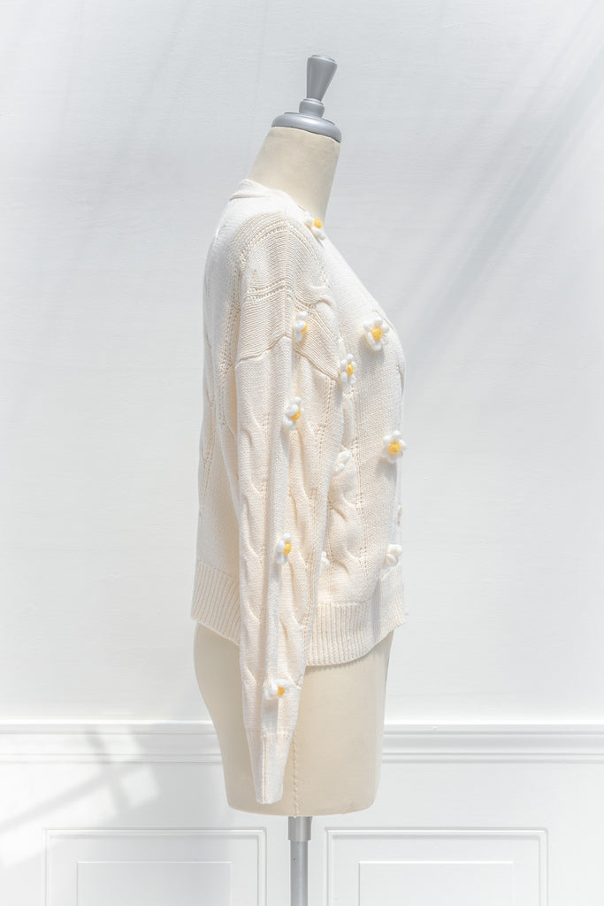 cute sweaters for fall. back to school outfits. a 3d flower cream cardigan. side view. 