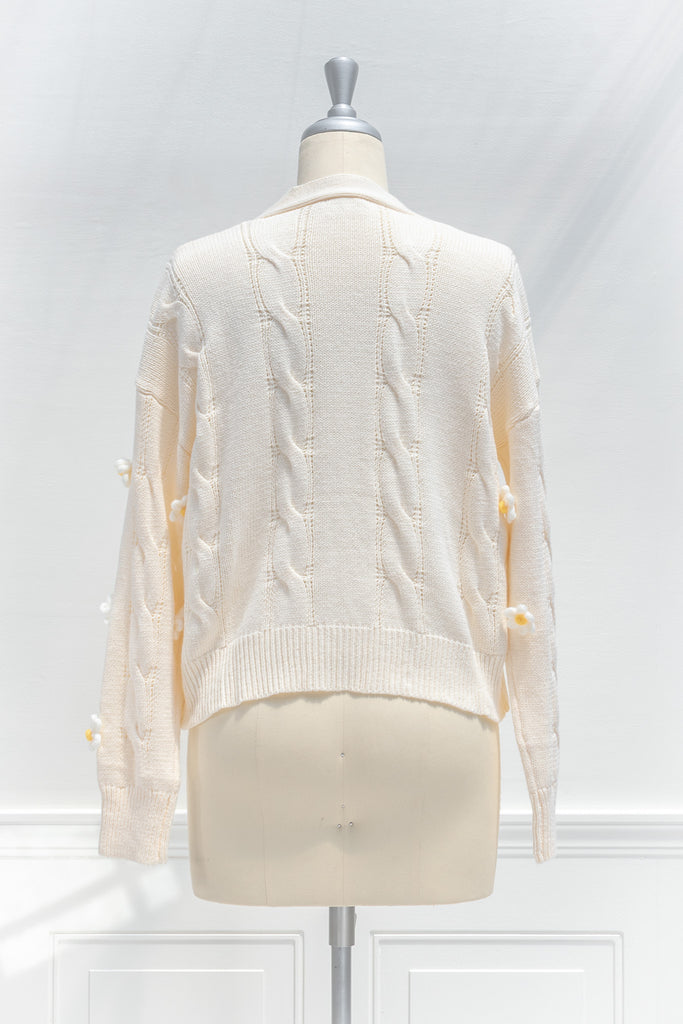 cute sweaters for fall. back to school outfits. a 3d flower cream cardigan. back view. 