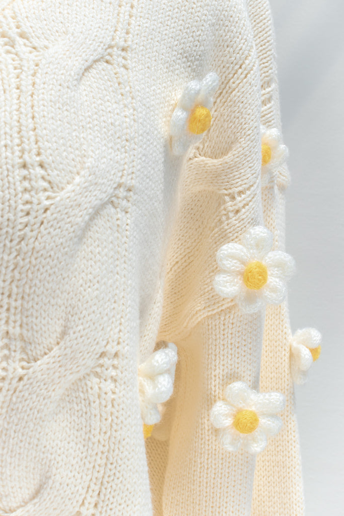 cute sweaters for fall. back to school outfits. a 3d flower cream cardigan. front view. 