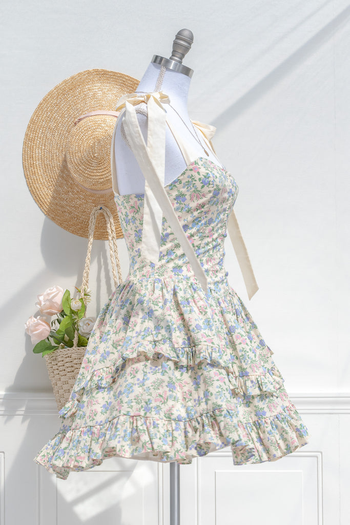 mini cottagecore floral dress - a cute mini dress with blue, pink, and green floral pattern. side view. spinning mannequin amantine. 