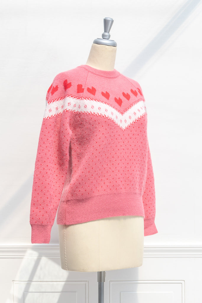 cute pink sweater with heart motif. heart print sweater. 