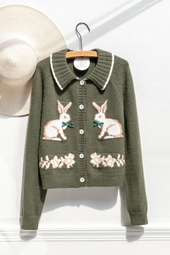 Amantine woodland-green rabbit cardigan with contrast-tipped collar, button front, and floral border — front view