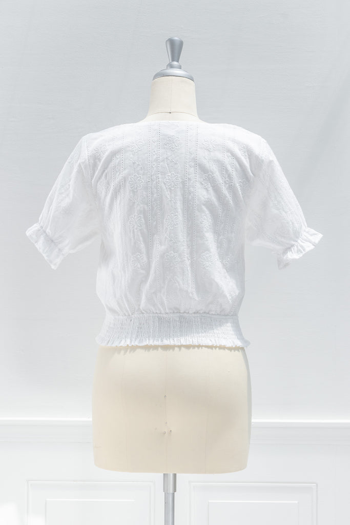 cute white cotton top. short sleeve, v neck, swiss dot. cute top. back view. amantine. 