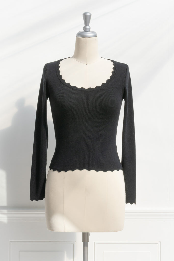 cute tops - black ribbed feminine top. round neck, long sleeve. front view. 