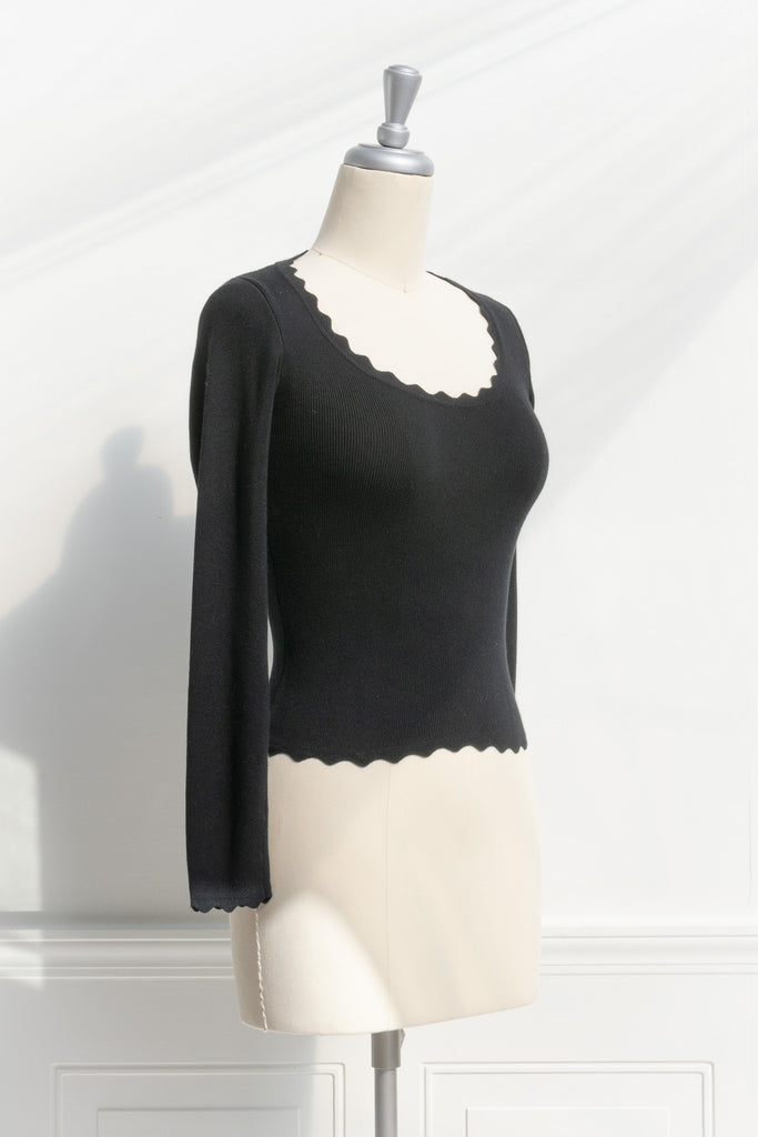 cute tops - black ribbed feminine top. round neck, long sleeve. front view. 