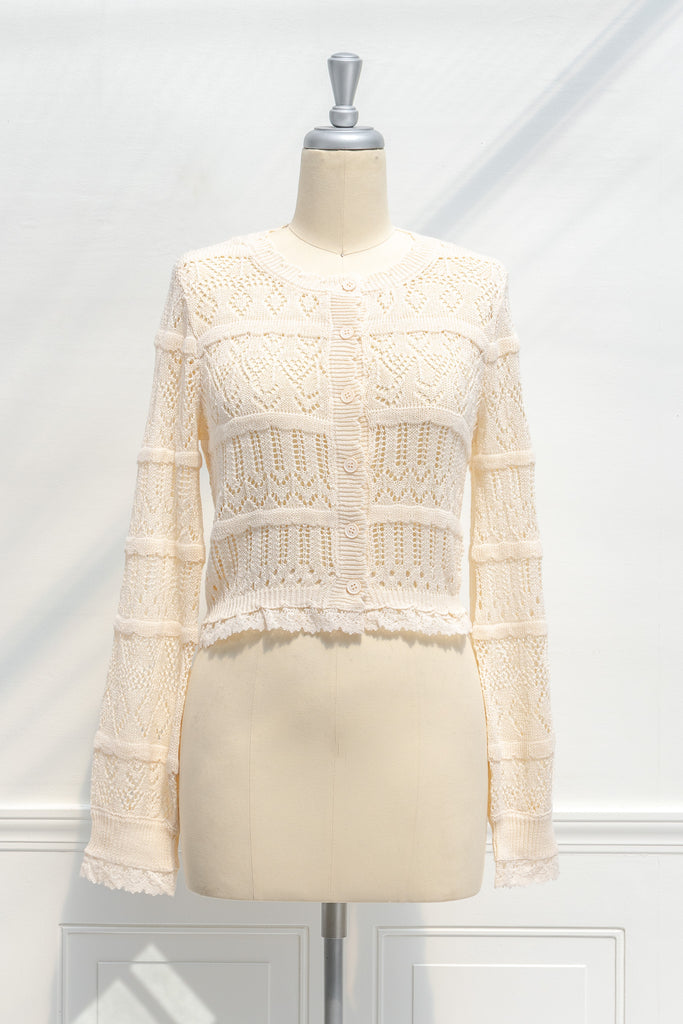 cute tops in cottagecore style. a light yellow knit, long sleeve cardigan dainty sweater. Front view. amantine. 