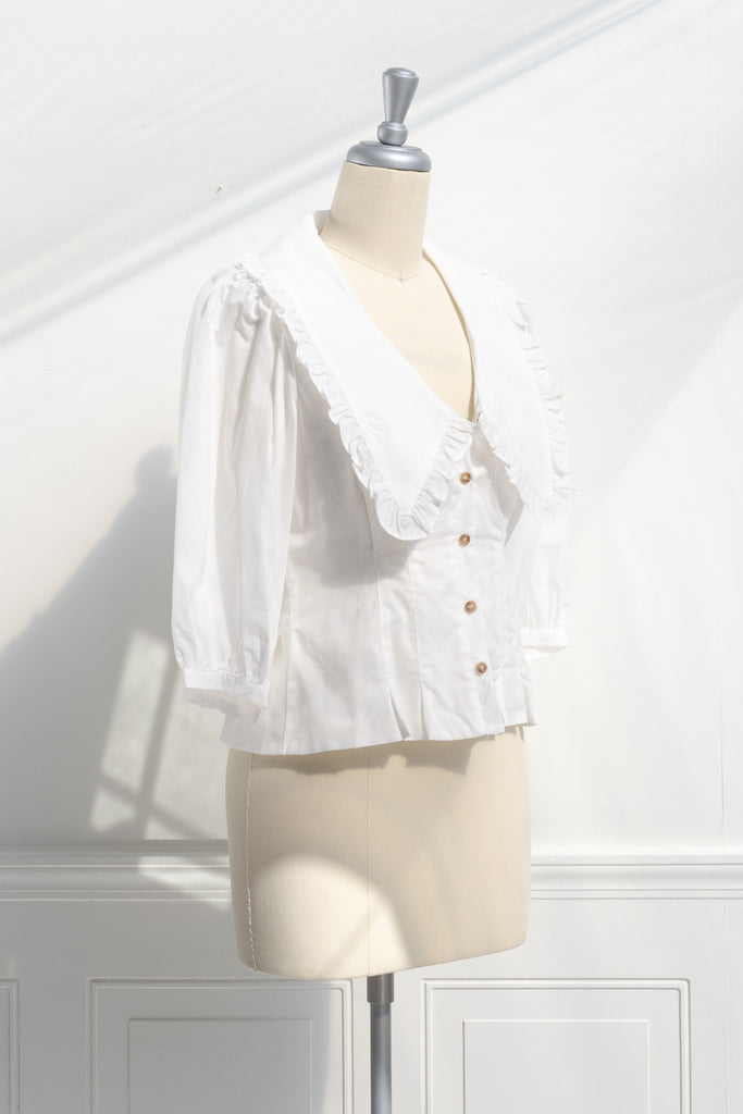 peter pan collar white blouse. french girl style basic with a cottagecore twist. side view. 