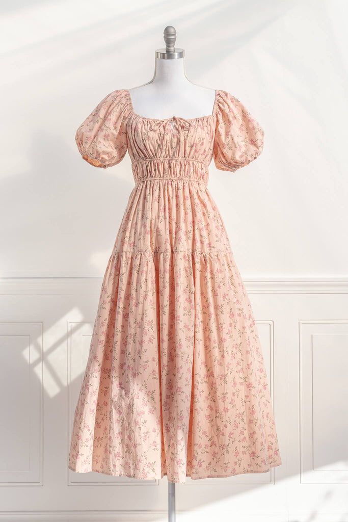cottagecore dress / peach fuzz dress.  a beautiful floral dress for spring with a square neckline, puff sleeves, and elastic waist. perfect for cottagecore dress goals. amantine - front view.