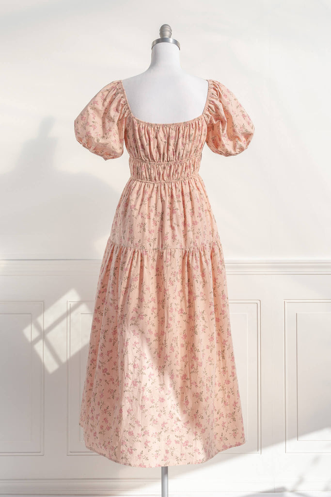 cottagecore dress / peach fuzz dress.  a beautiful floral dress for spring with a square neckline, puff sleeves, and elastic waist. perfect for cottagecore dress goals. amantine - back view.