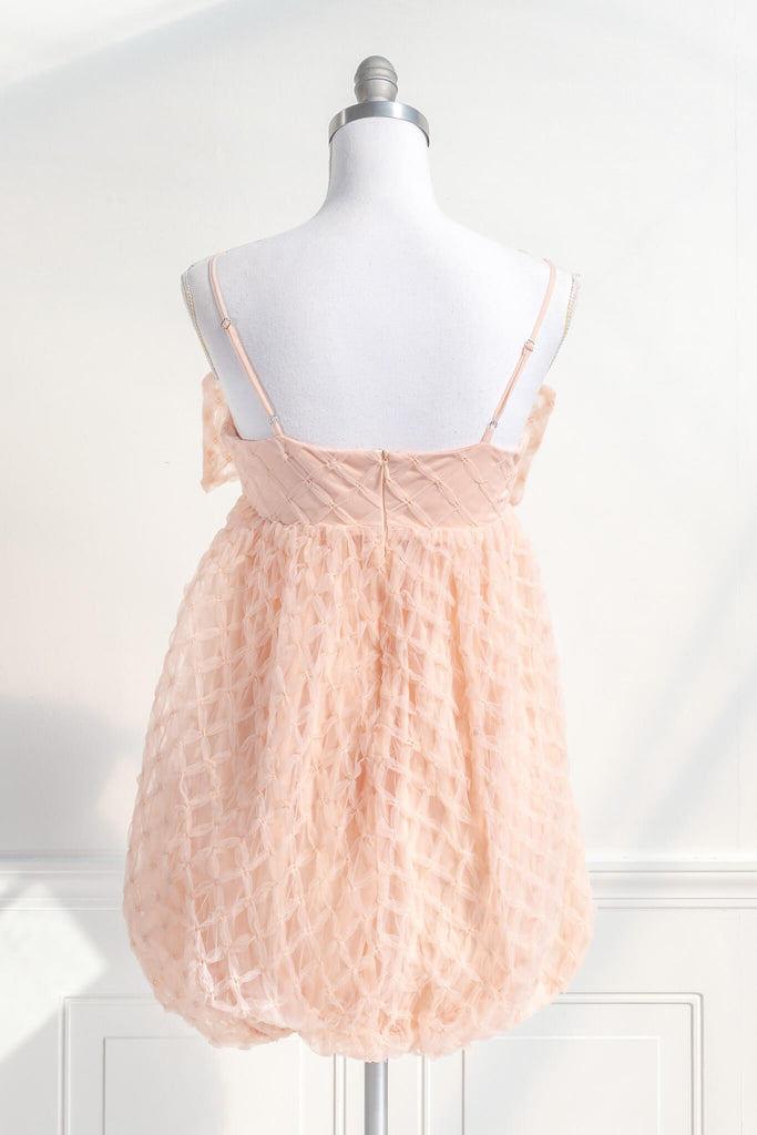 bow dress - a feminine dress with a bow in the front in pink and textured organza. Amantine. back View. 