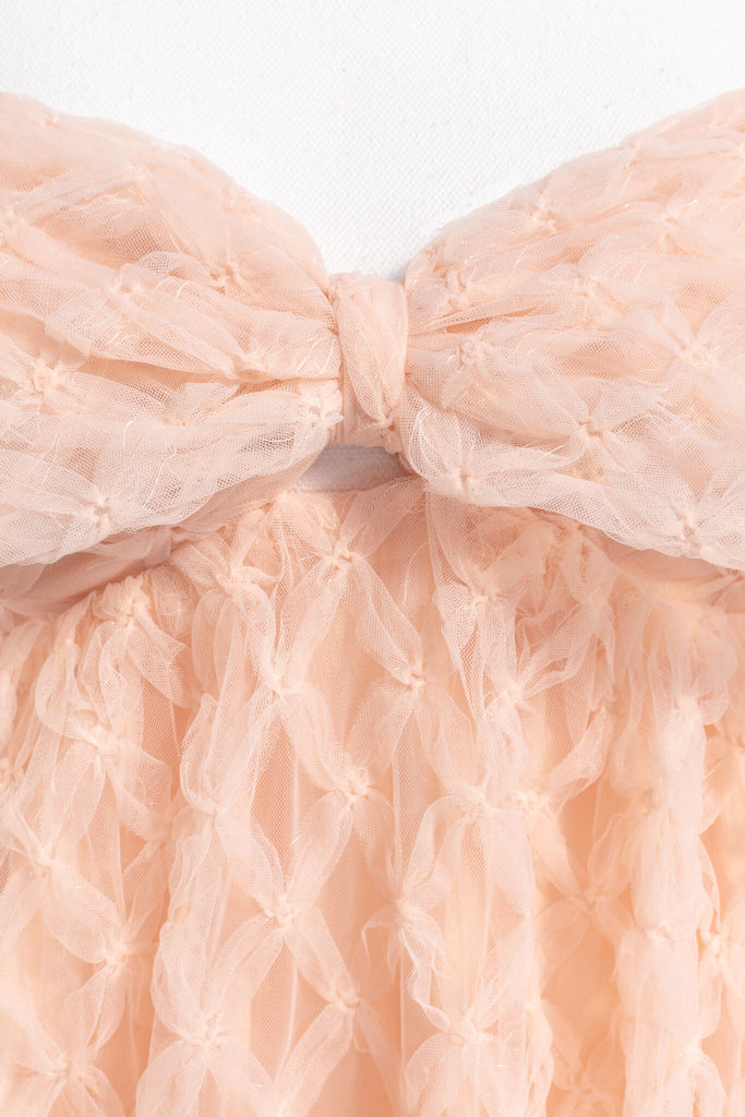 bow dress - a feminine dress with a bow in the front in pink and textured organza. Amantine. bow detail View. 