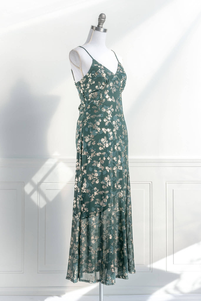 French dresses - inspired by feminine, elegant, cottagecore styles. A green dress with gold metallic floral detail. amantine dresses. quarter view. 