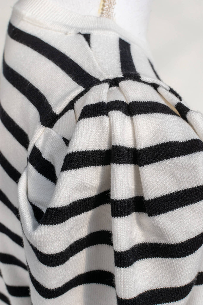 French striped top - feminine, and romantic classic french clothing. black and white pattern. sleeve view. 
