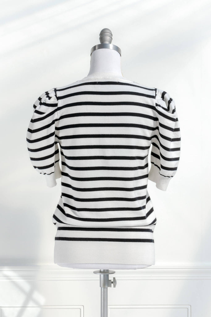 French striped top - feminine, and romantic classic french clothing. black and white pattern. back view. 