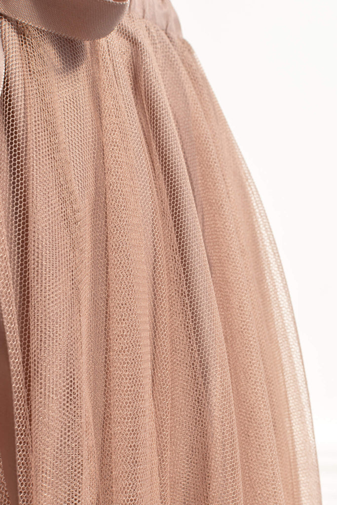 Feminine skirts - a long tulle skirt with a bow decorative closure, featuring two layers of tulle and a slip lining. amantine. tulle view. 