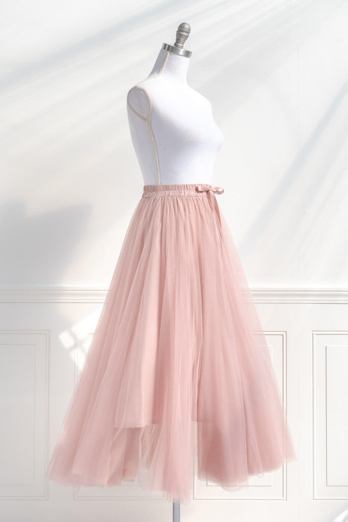pink clothing- a french style pink tulle maxi skirt. french girl skirt with bow. quarter side view. amantine.