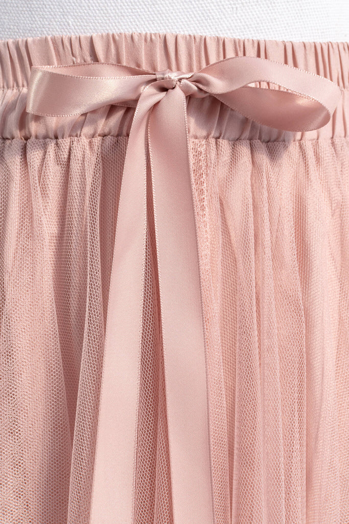 pink clothing- a french style pink tulle maxi skirt. french girl skirt with bow. pink bow detail view. amantine.