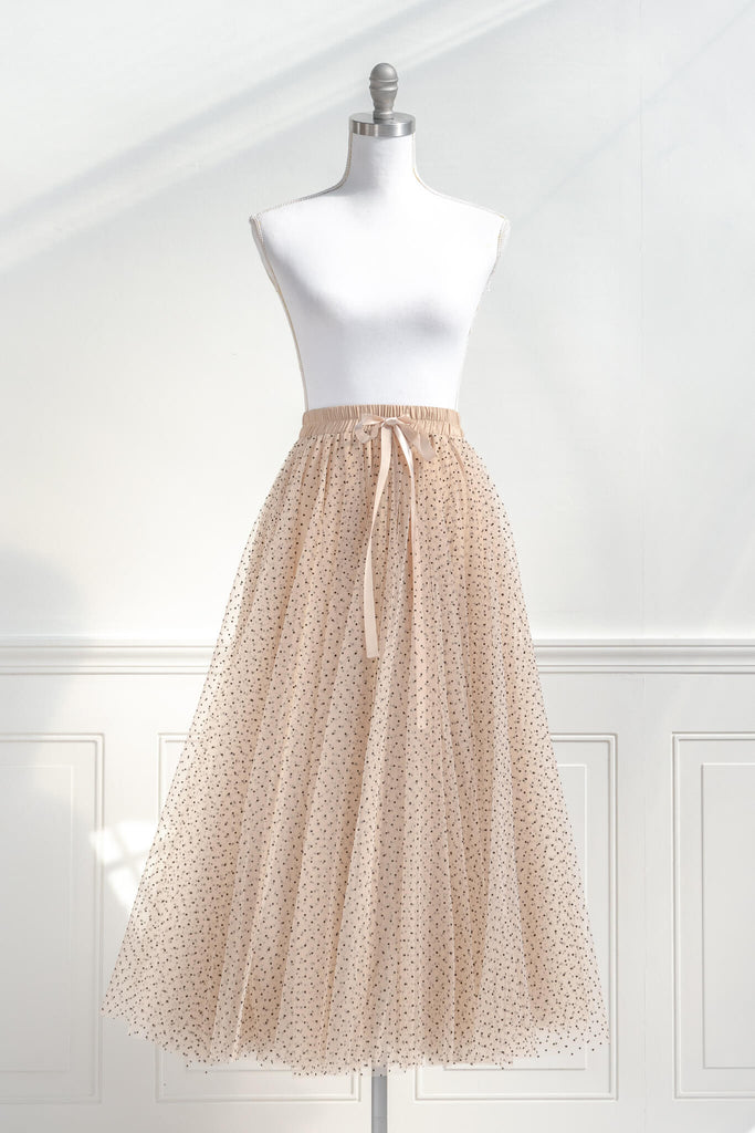 feminine clothing- a french style polka dot tulle maxi skirt. french girl skirt with bow. front view. amantine.