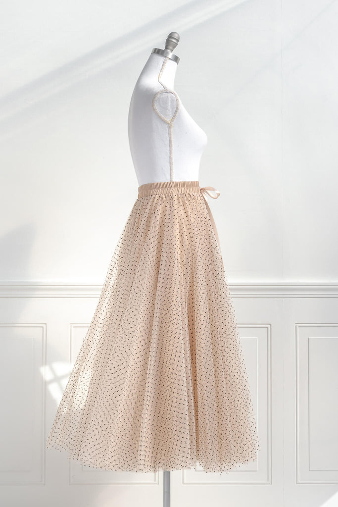 feminine clothing- a french style polka dot tulle maxi skirt. french girl skirt with bow. side view. amantine.