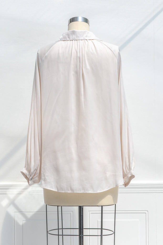 feminine blouses for work - a work appropriate beige button down dress shirt. back view. 