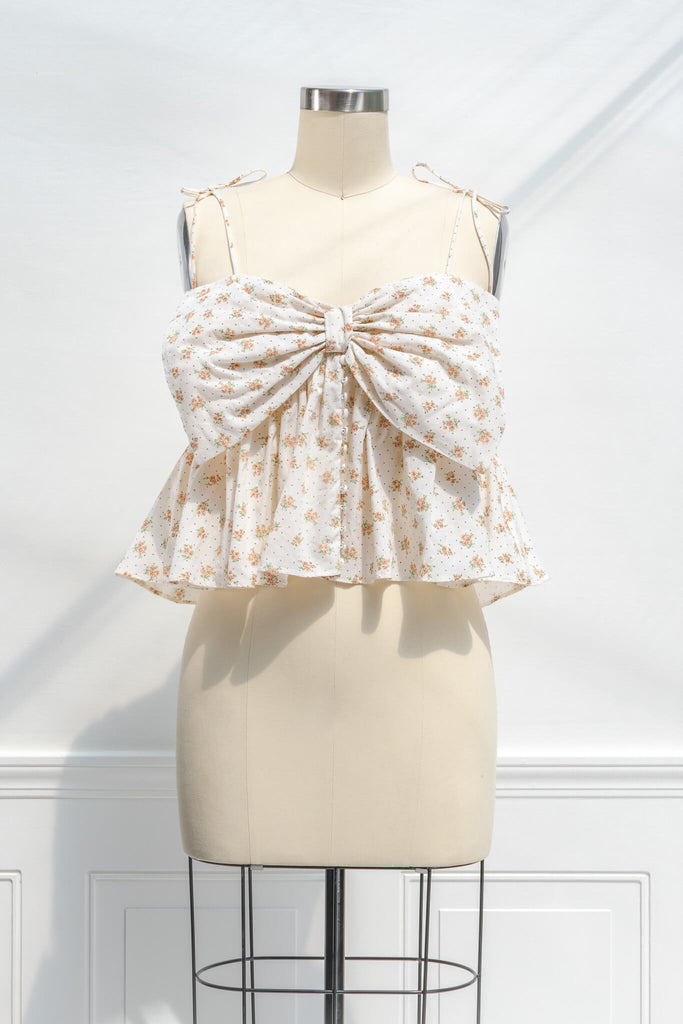 blouse with bow - a feminine clothing item with a big bow, button down, and floral details blouse. front view. amantine. 