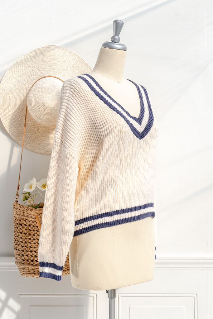 light academia college classic sweater, cream, v neckline, long sleeves. 3/4 side view. amantine.