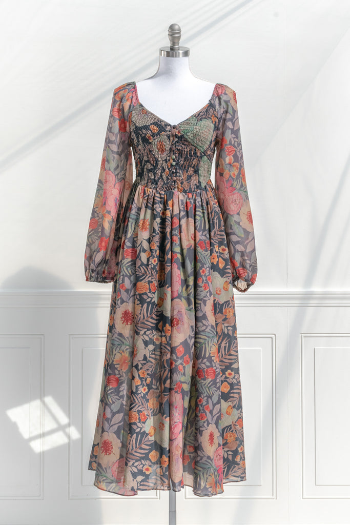 a modest, long sleeve, floral dress. cottagecore style. dark floral cottage core print. front view. 