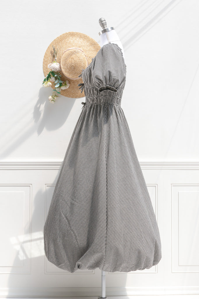 Amantine gingham midi dress — side view with puff sleeve, defined shirred waist, and bubble-hem skirt
