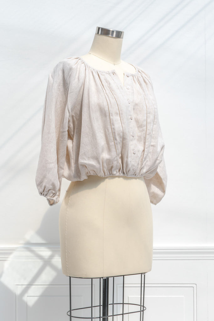 cottagecore outfits - a french and feminine style linen top for work. Button down, long sleeves, round neckline. quarter side view. 