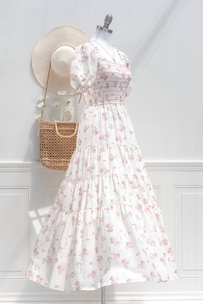 floral dresses for fall - a beautiful cottagecore style cream dress with pink floral print. side view. 