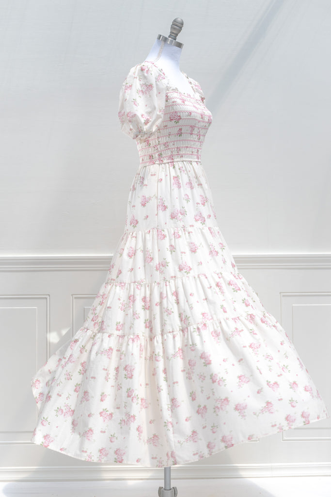 floral dresses for fall - a beautiful cottagecore style cream dress with pink floral print. side view. 