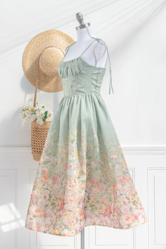 Floral outfit. A beautiful cottagecore floral dress outfit with a light green top and a floral bottom. Perfect for parties, or just to romanticize. side view. amantine.  