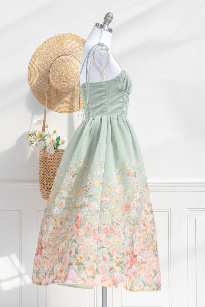 Floral outfit. A beautiful cottagecore floral dress outfit with a light green top and a floral bottom. Perfect for parties, or just to romanticize. side view. amantine.  