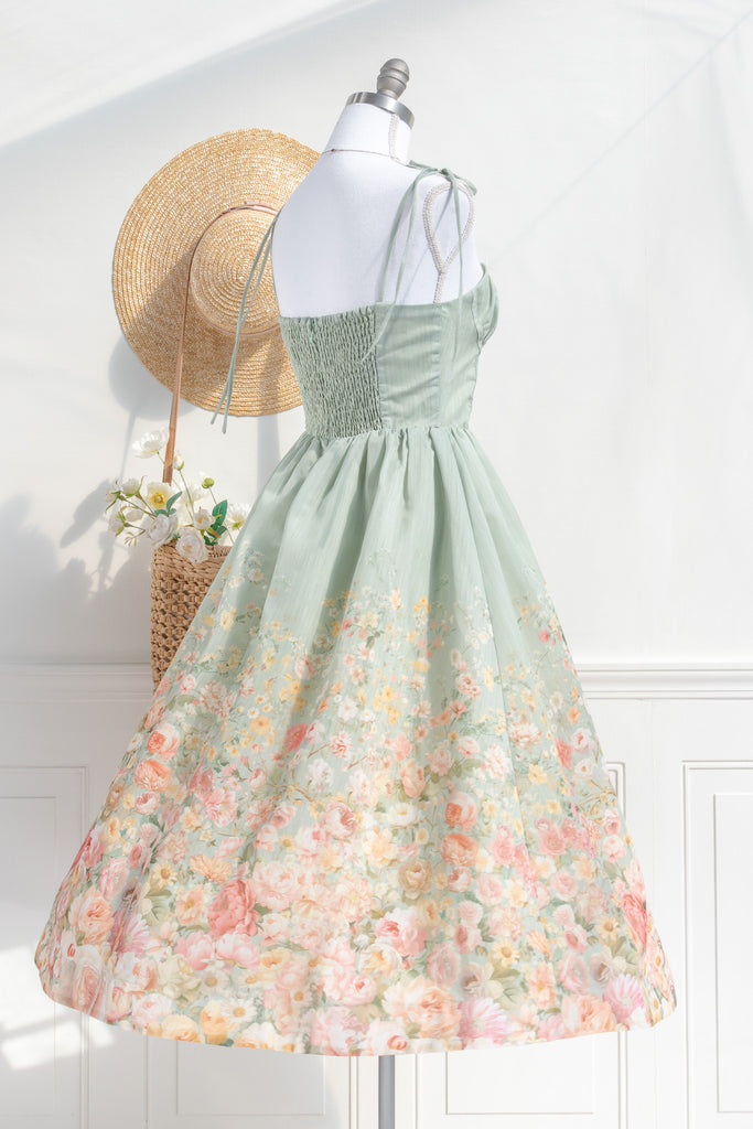 Floral outfit. A beautiful cottagecore floral dress outfit with a light green top and a floral bottom. Perfect for parties, or just to romanticize. back 3/4 view. amantine.  