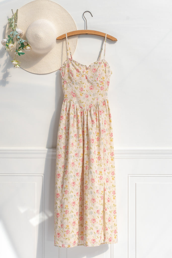 Romantic dresses - a beautiful floral cottagecore dress with structured bodice, pretty florals, on a cream fabric. perfect for the park, or to stroll. cottagecore romantic dress. front view. 