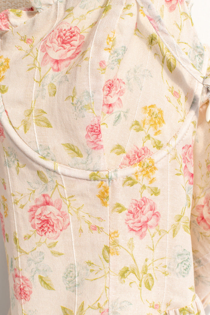 Romantic dresses - a beautiful floral cottagecore dress with structured bodice, pretty florals, on a cream fabric. perfect for the park, or to stroll. cottagecore romantic dress. up close floral fabric view. 