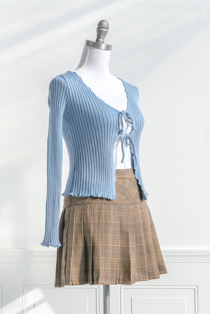 feminine tops with a french and vintage style - a light baby blue front tie top with scalloped edges - styled with plaid skirt view - amantine.