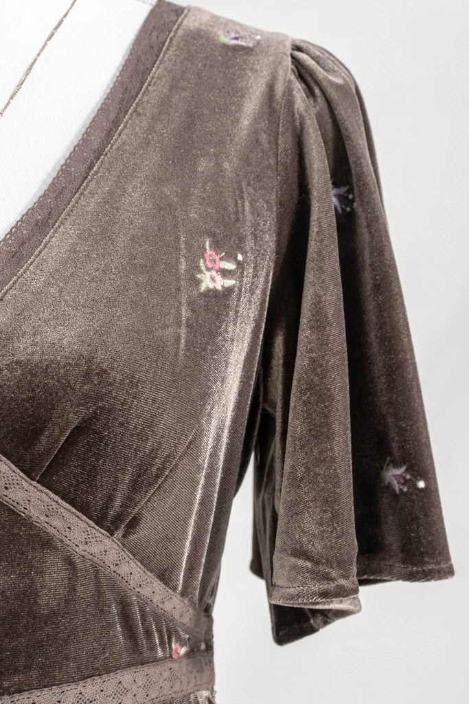 a french and cottage core inspired dress - mocca color velvet with cotton lacing detail and small embroidered flowers all throughout. up close view - amantine.  