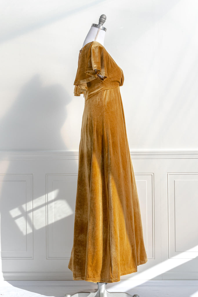 long yellow mustard velvet holiday dress - featuring a feminine cottage core silhouette, v neckline, short sleeves, and long skirt. side view - amantine.
