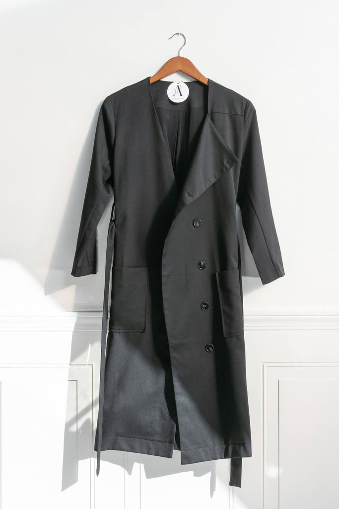 lightweight long jacket with large front pockets, and button up front. Parisian-chic day-to-night look. on hanger view. amantine.