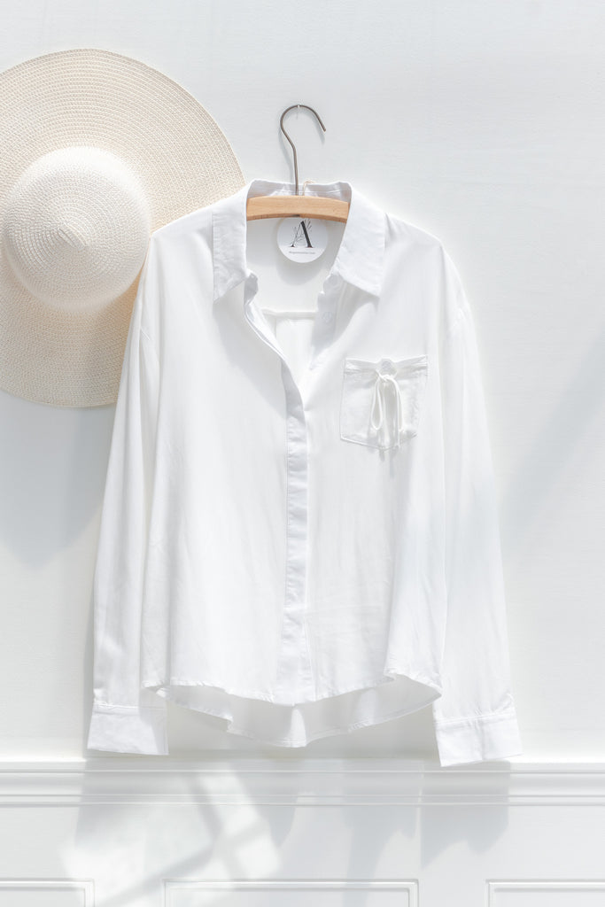 cute french style white button down shirt. front view.