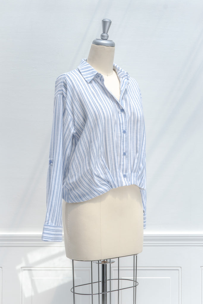 french girl style tops for work - a striped blue and white button down blouse. front view. amantine. 