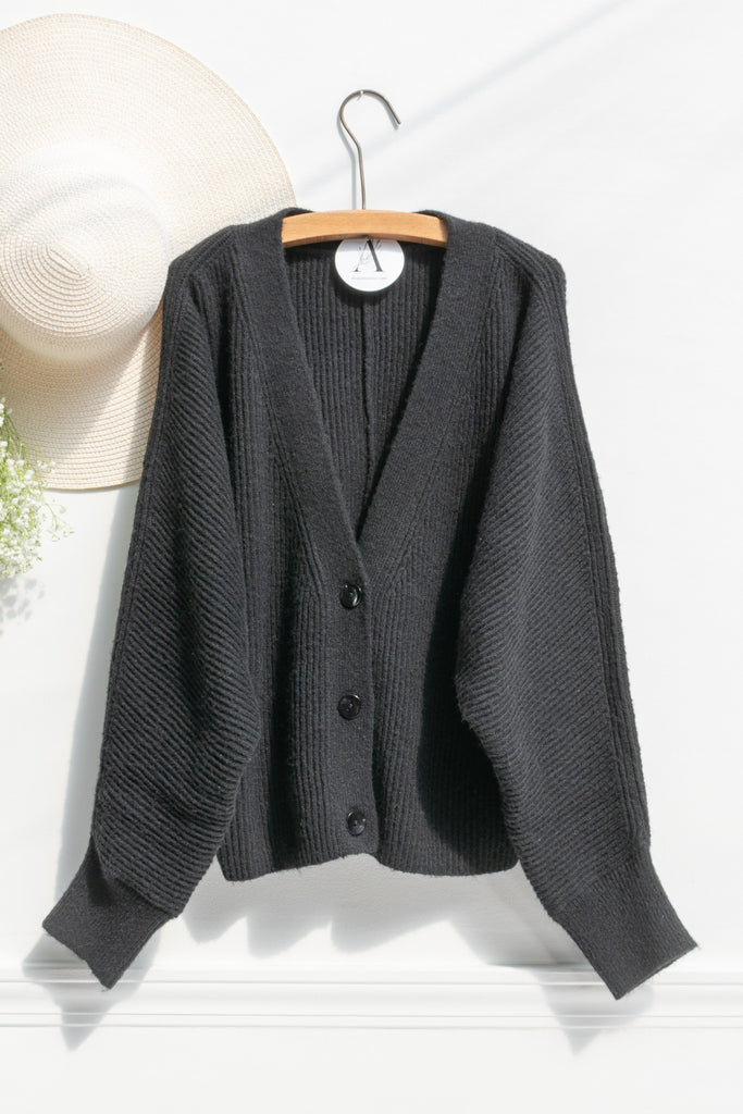 french tops - a cute elegant button down cardigan. front view. 