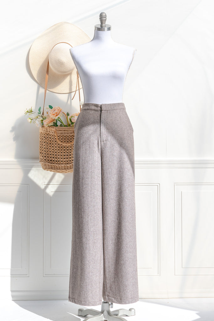 french girl style trousers. wide leg taupe pants with pockets. front view. 