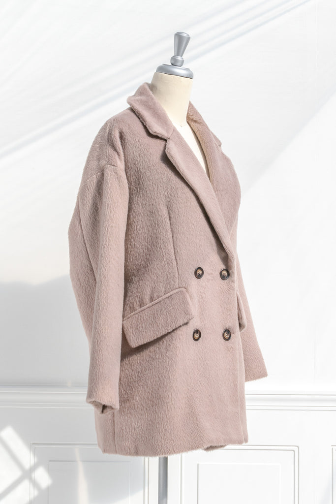 french style winter coat - feminine french girl style double breast camel coat. side view. 